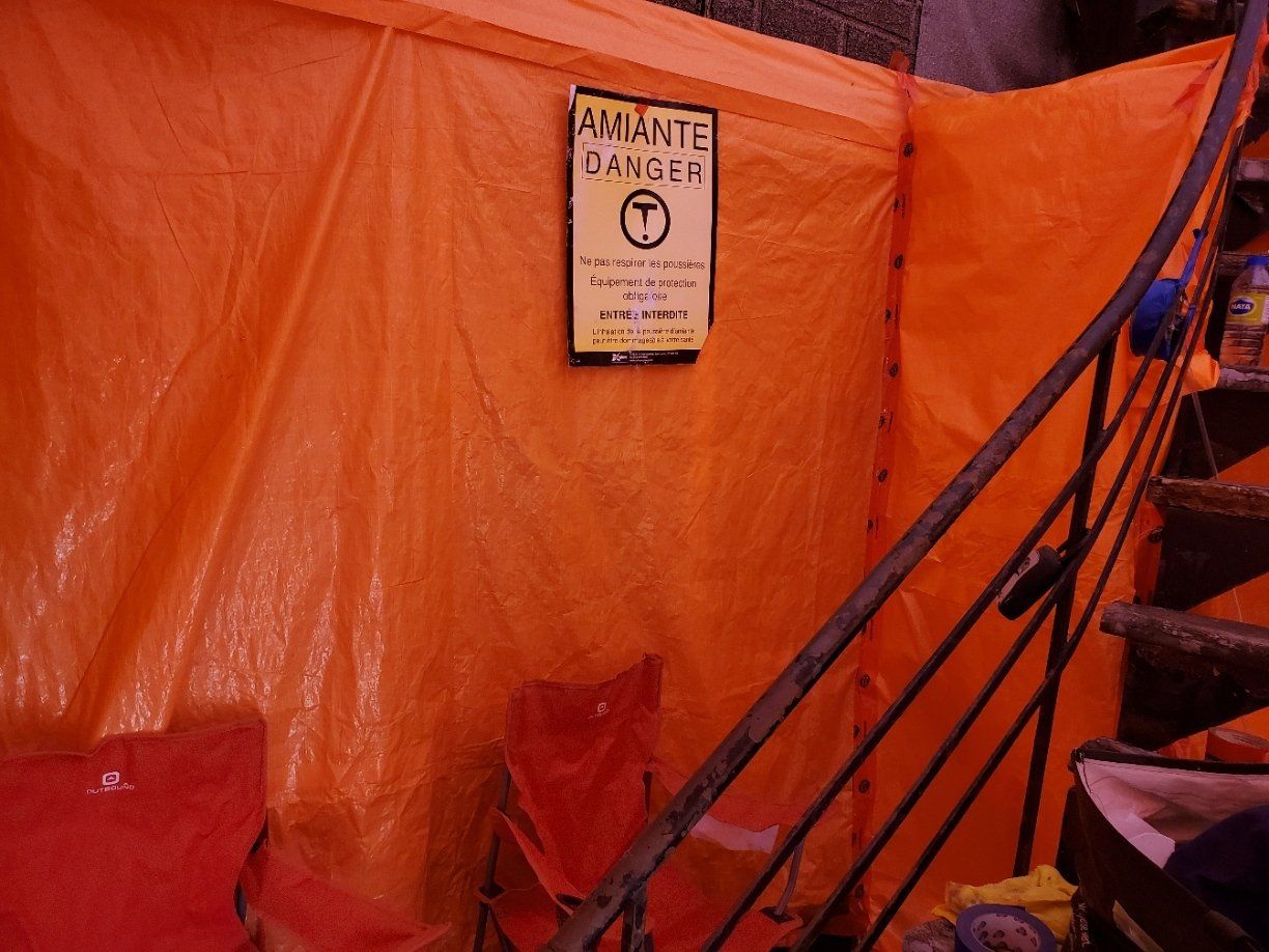 Orange tarp-covered area with