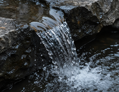 Water moving over dark stone