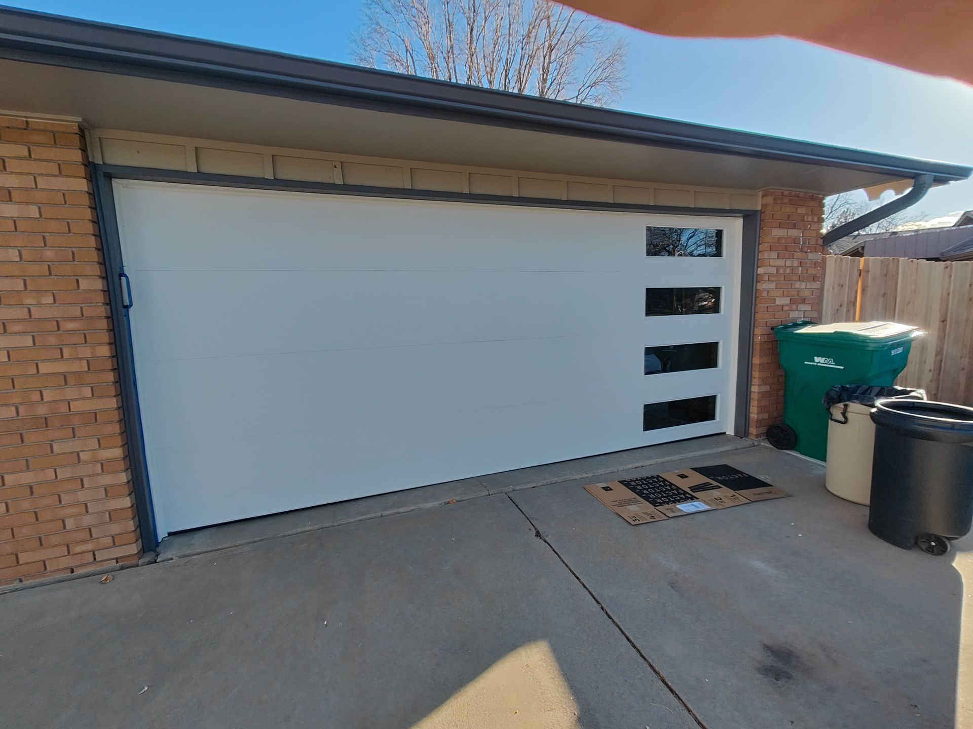 White Flush Panel Garage Door With Left Side Long Clear Side windows
