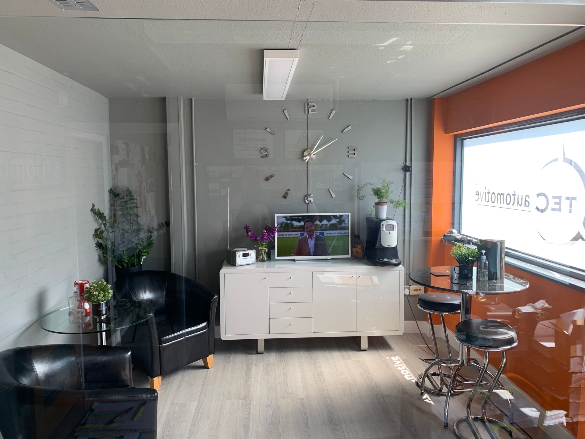 A living room with a large clock on the wall