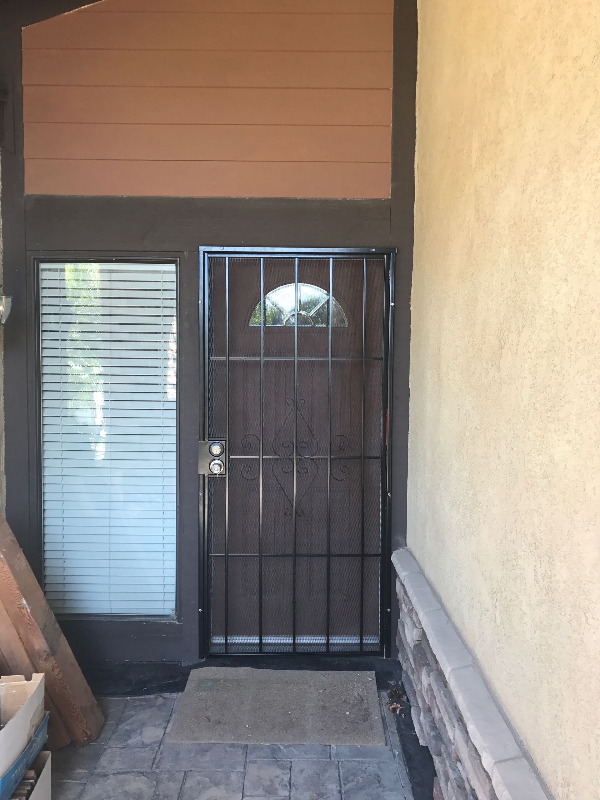 Entryway with a dark security screen door and interior hallway view