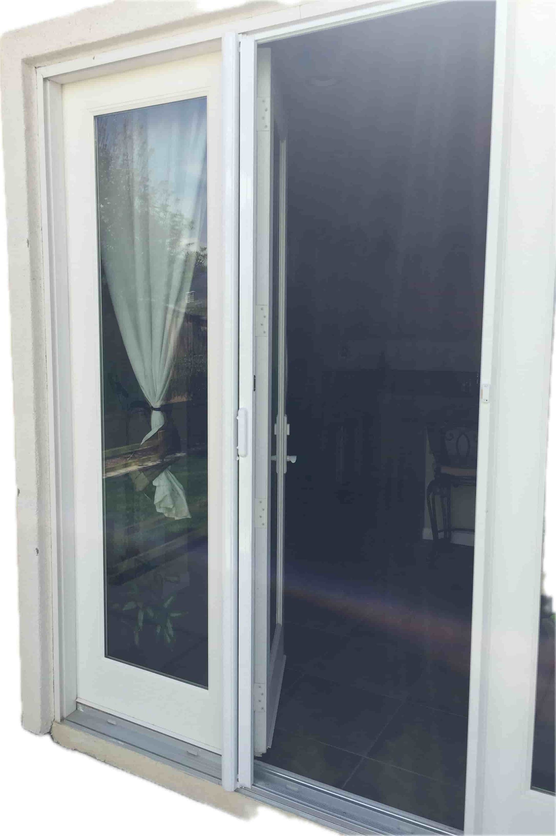 Sliding glass door with a white-framed screen door installed
