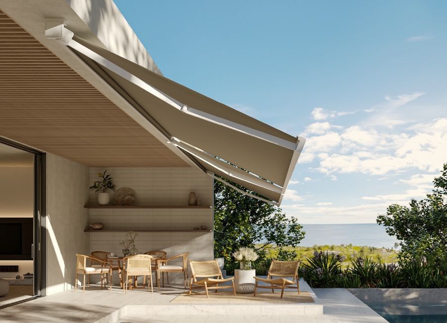 Custom motorized retractable awning providing shade on a backyard patio
