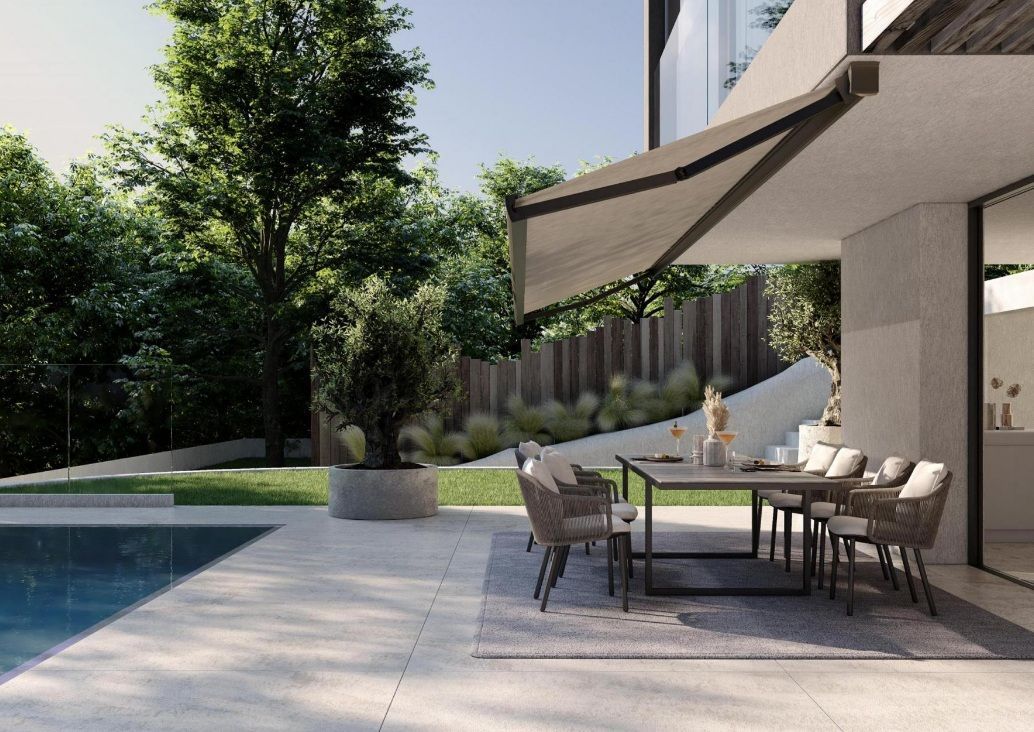 Custom motorized awning providing shade over an outdoor dining area