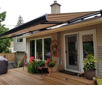 Electric retractable awning extended over an outdoor seating area