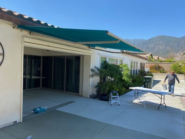 Motorized awning installation for a residential garage and driveway in the Inland Empire