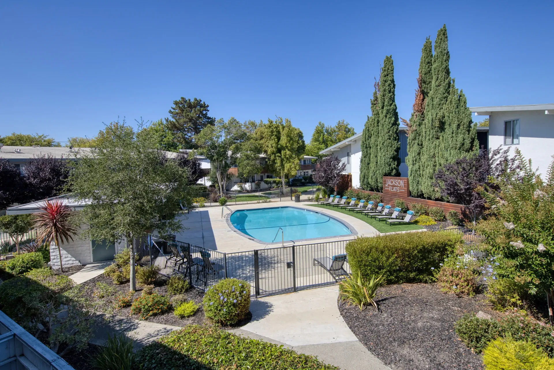 Jackson Flats property swimming pool and lounge chairs