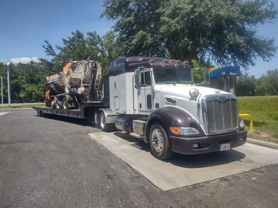a semi truck is parked on the side of the road