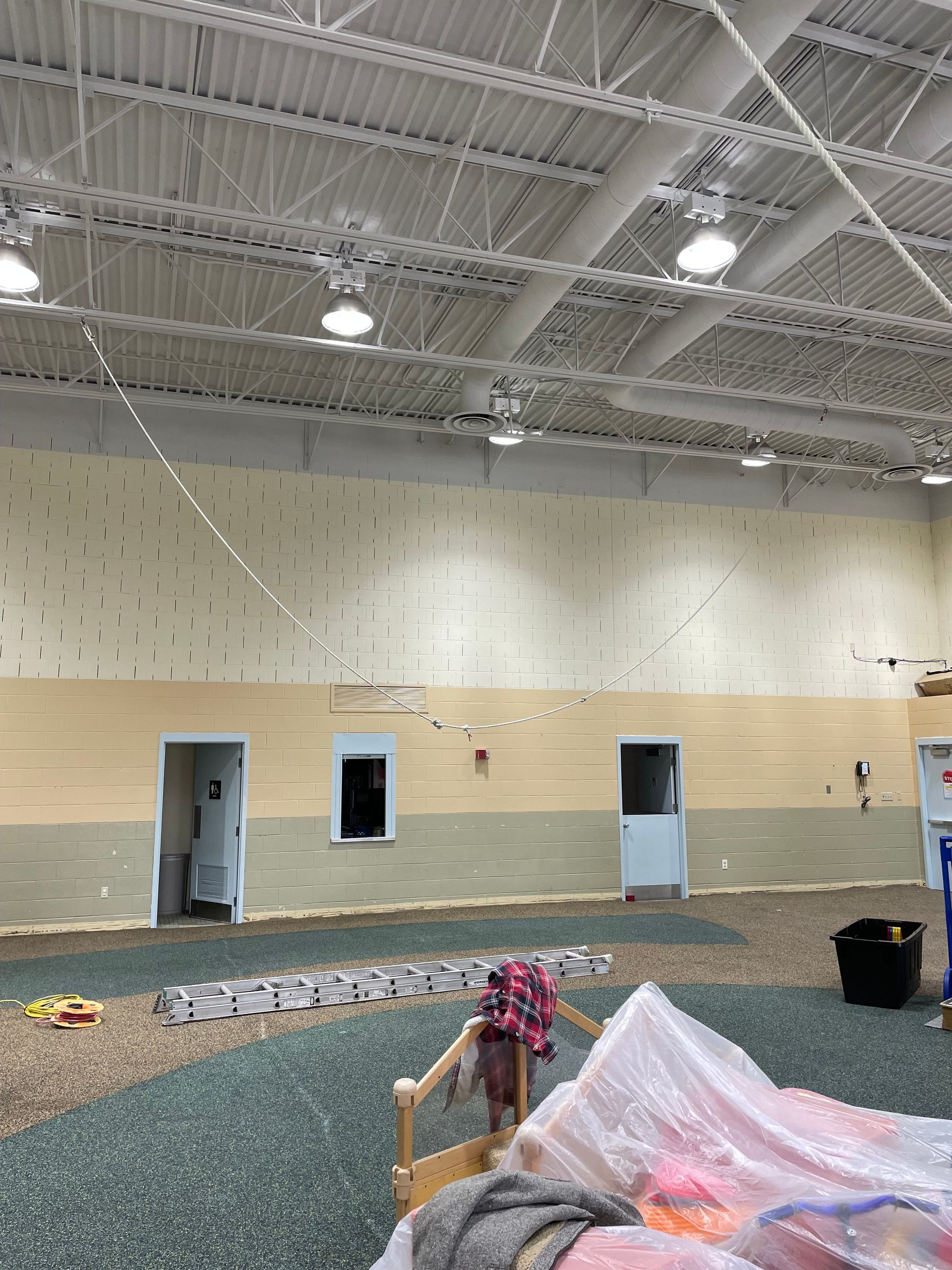 A large room with a lot of windows and a ceiling.