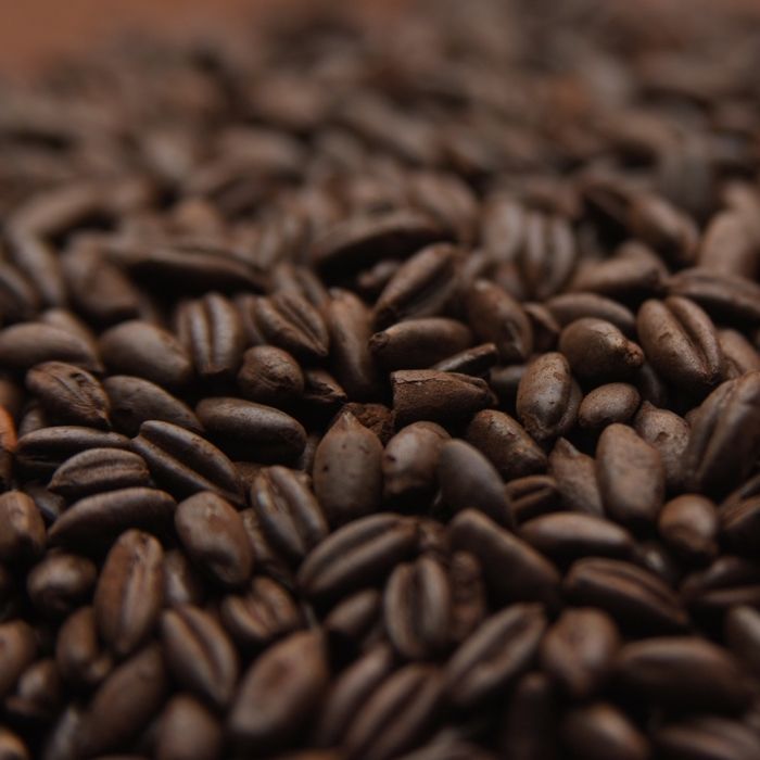 A close up of a pile of brown beans