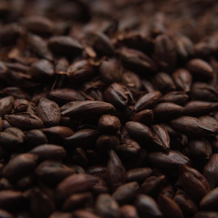 A close up of a pile of brown grains.