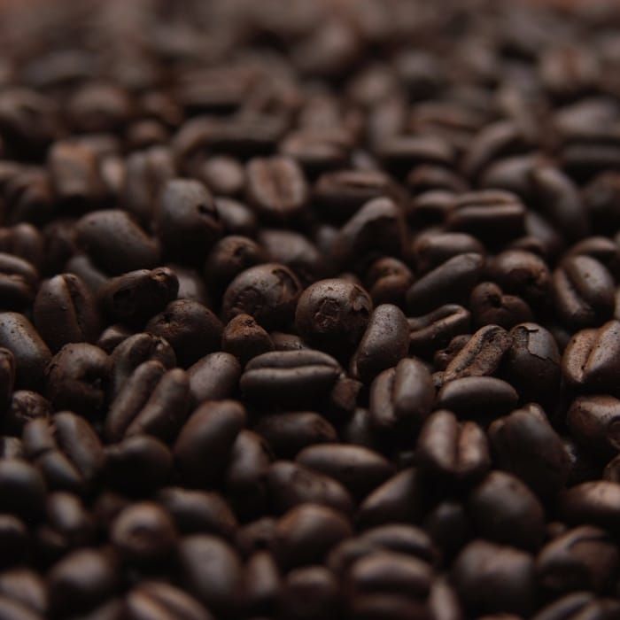 A close up of a pile of coffee beans