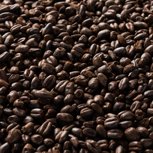 A close up of a pile of coffee beans