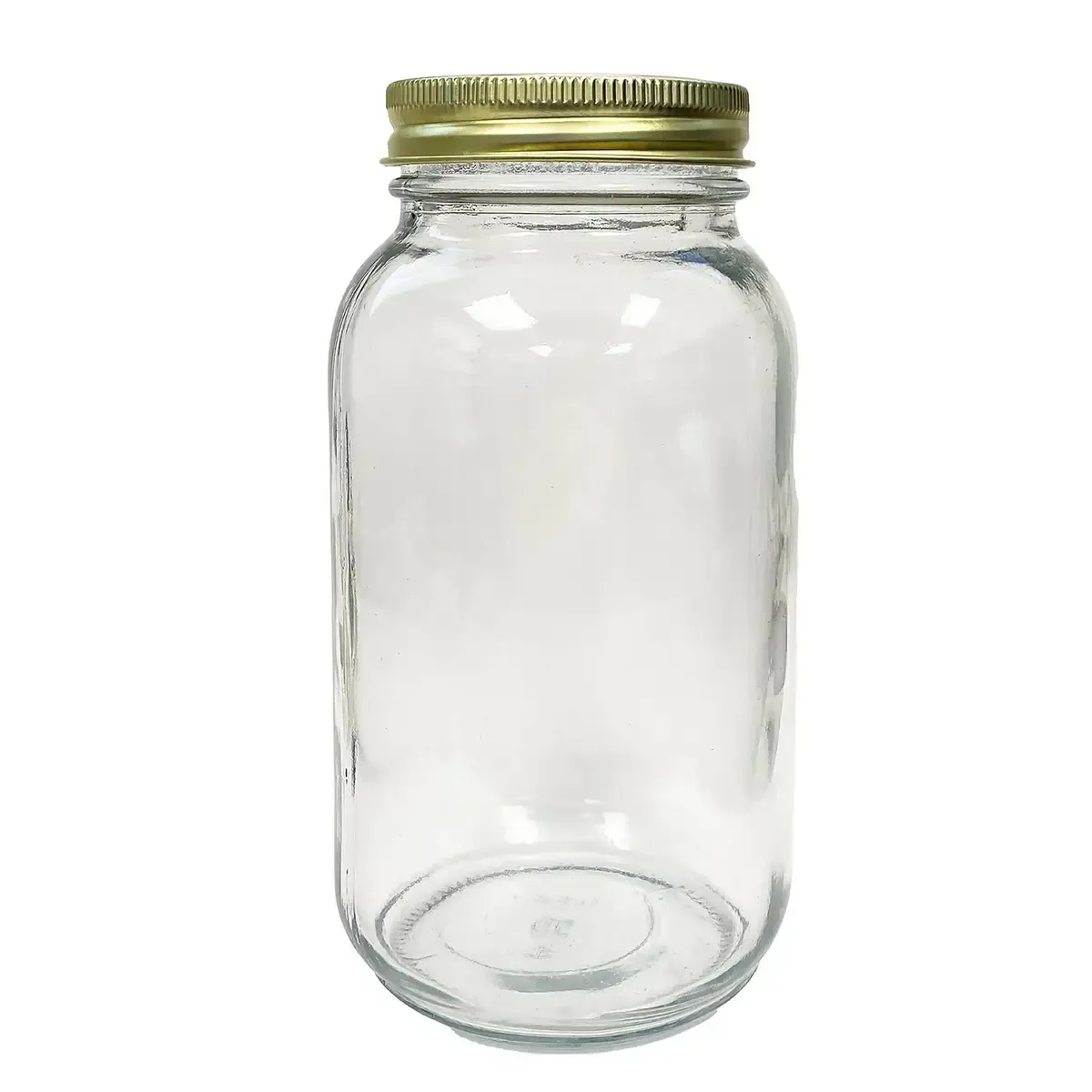 A clear glass jar with a gold lid on a white background.