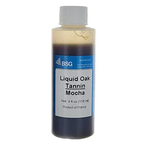 A bottle of liquid oak tannin mocha on a white background.