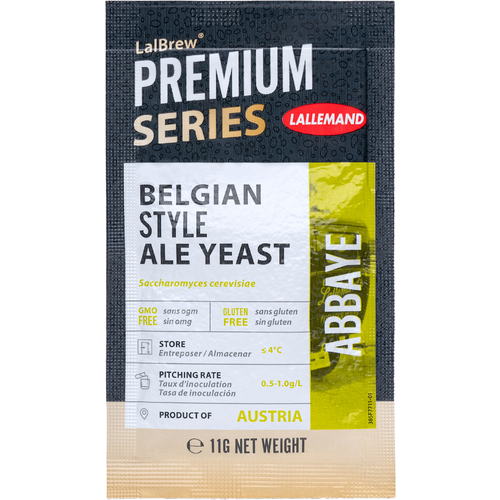 A package of belgian style ale yeast is sitting on a table.