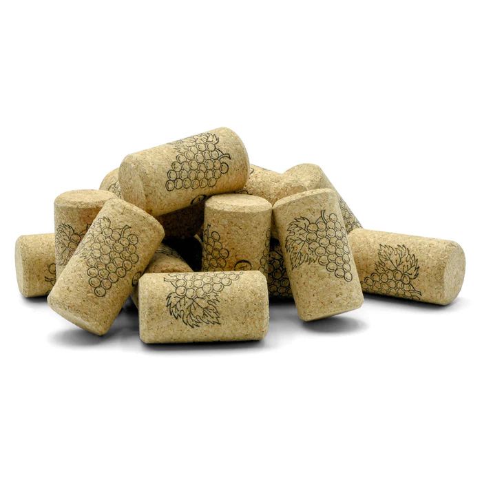 A pile of wine corks with grapes on them
