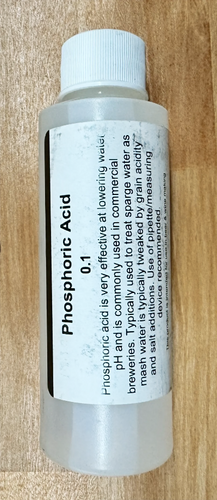 A bottle of phosphoric acid is sitting on a wooden table.