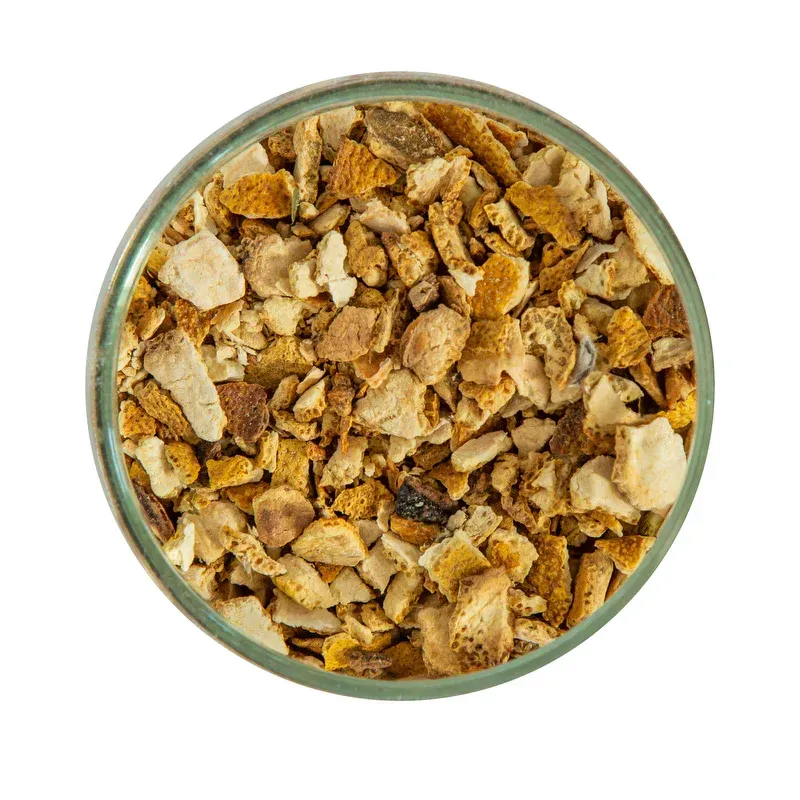 A close up of a glass bowl filled with a pile of food on a white background.