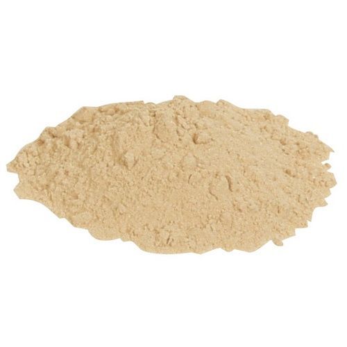 A pile of brown powder on a white background