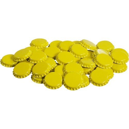 A pile of yellow bottle caps on a white background
