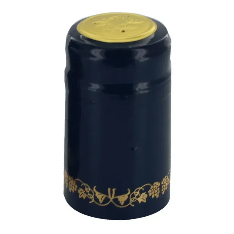 A blue wine bottle with a gold foil cap