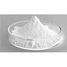 A glass bowl filled with white powder on a table.