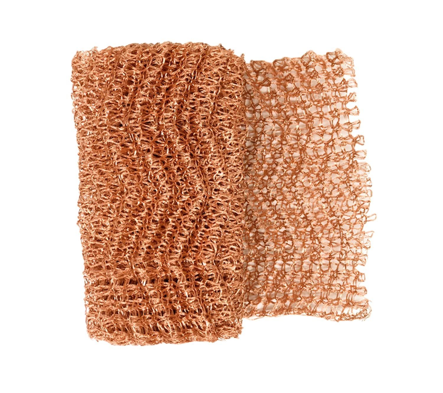 A close up of a piece of copper mesh on a white background