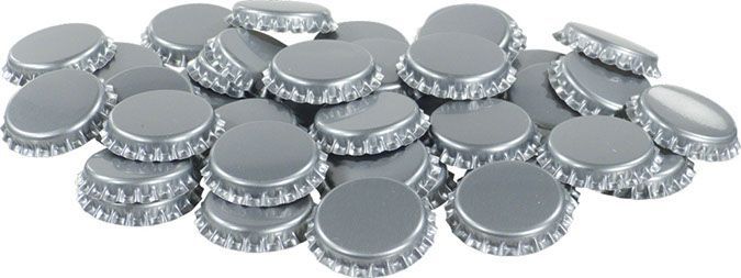 A pile of bottle caps are stacked on top of each other on a white background.