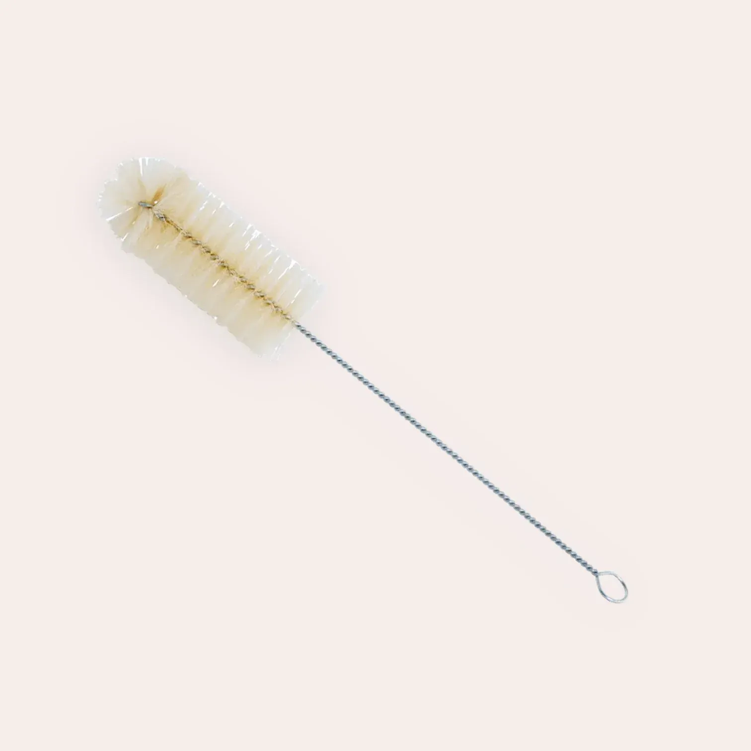 A white bottle brush with a metal handle on a white background.