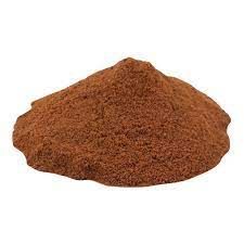 A pile of brown powder on a white background.