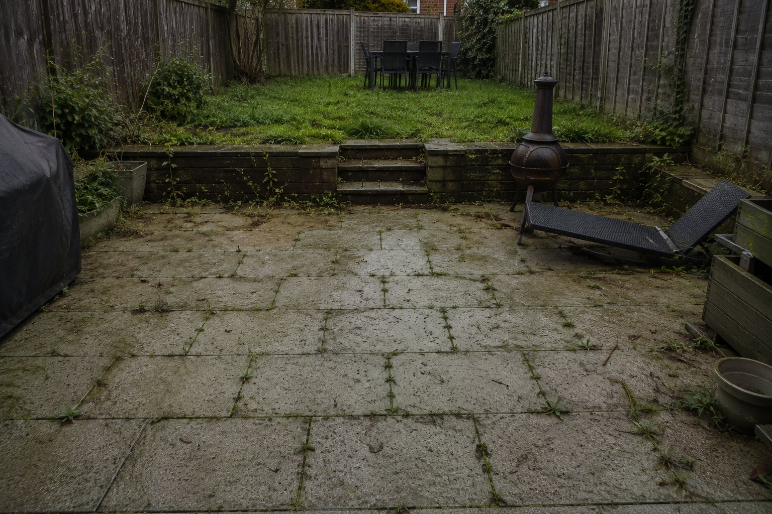 Aged resin driveway with cracks before resurfacing