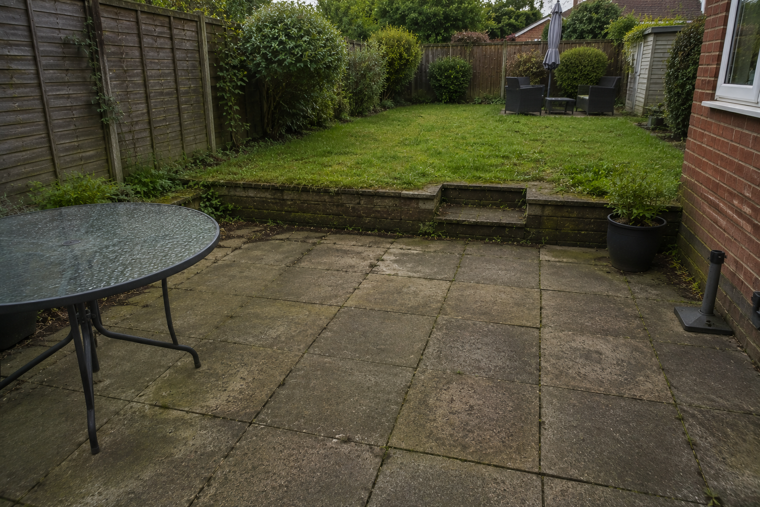 Aged resin driveway with cracks before resurfacing