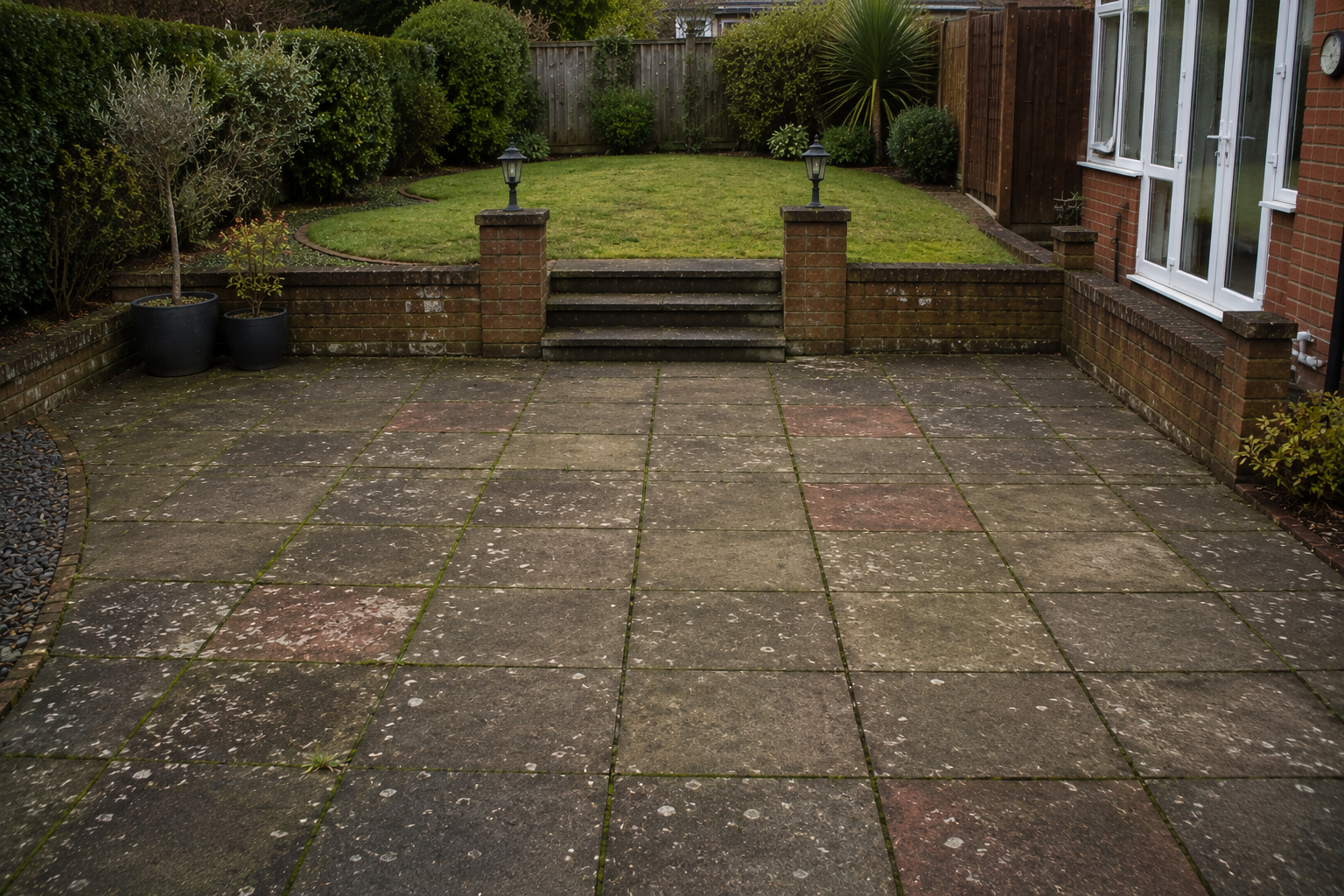Aged resin driveway with cracks before resurfacing