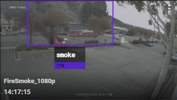 a video of a fire with smoke coming out of it .