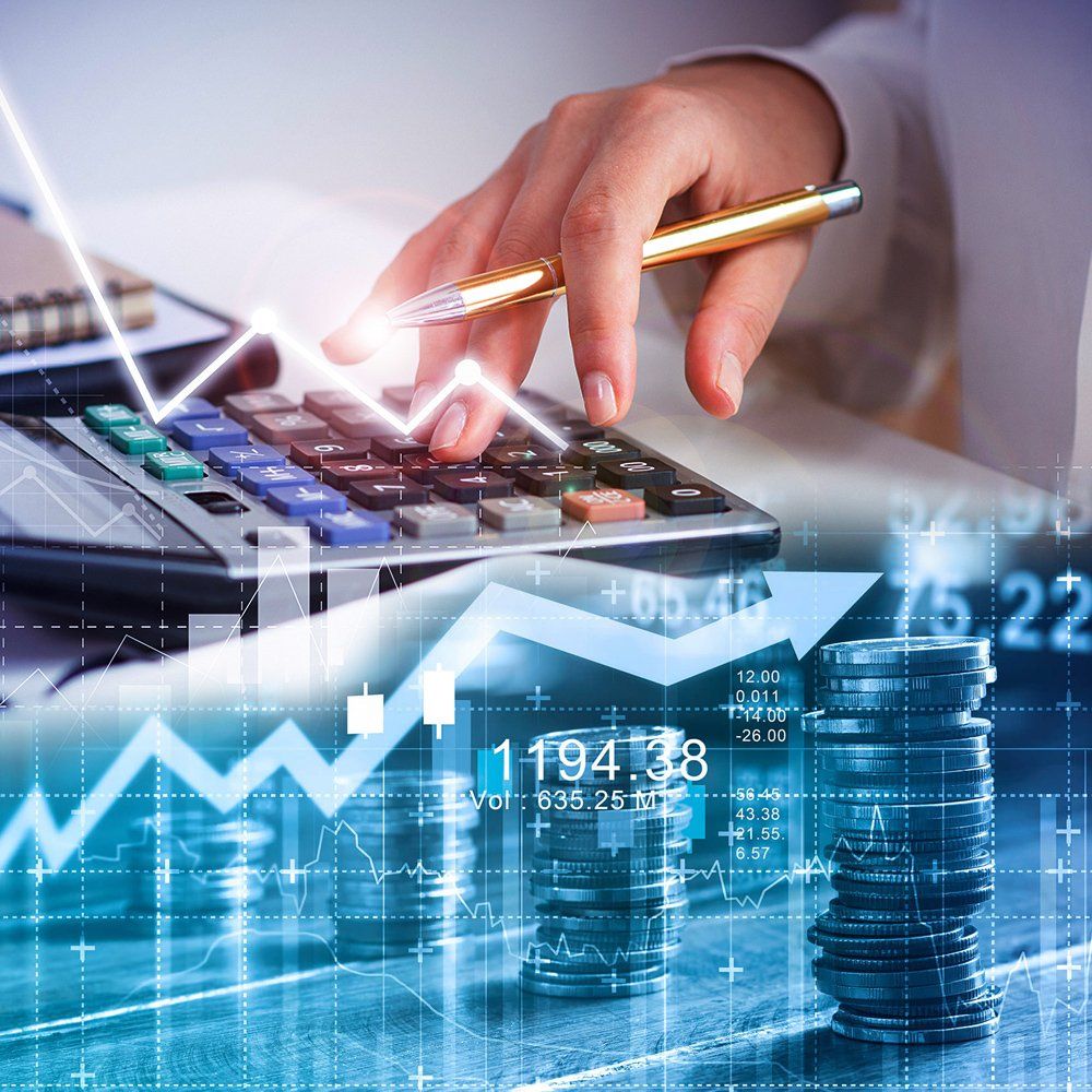 Close-up of a hand using a calculator, with a rising profit graph Close-up of a hand using a calculator, with a rising profit graph