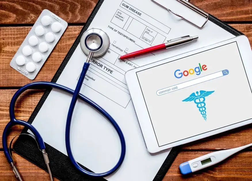 A stethoscope, tablet, digital thermometer, and doctor's clipboard arranged on a table, symbolizing a medical workspace. A stethoscope, tablet, digital thermometer, and doctor's clipboard arranged on a table, symbolizing a medical workspace.