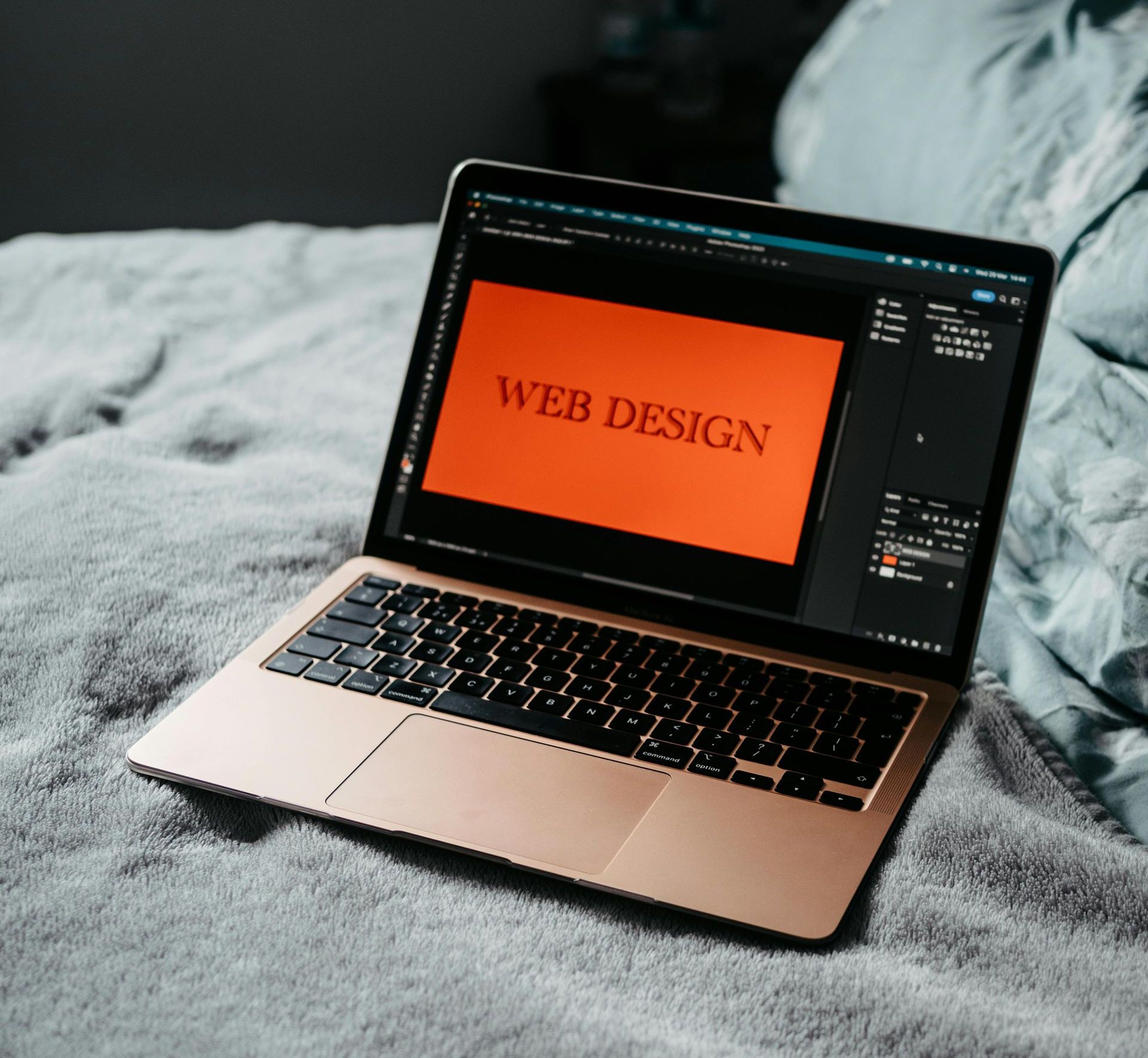 Laptop displaying the words Web Design on the screen Laptop displaying the words Web Design on the screen