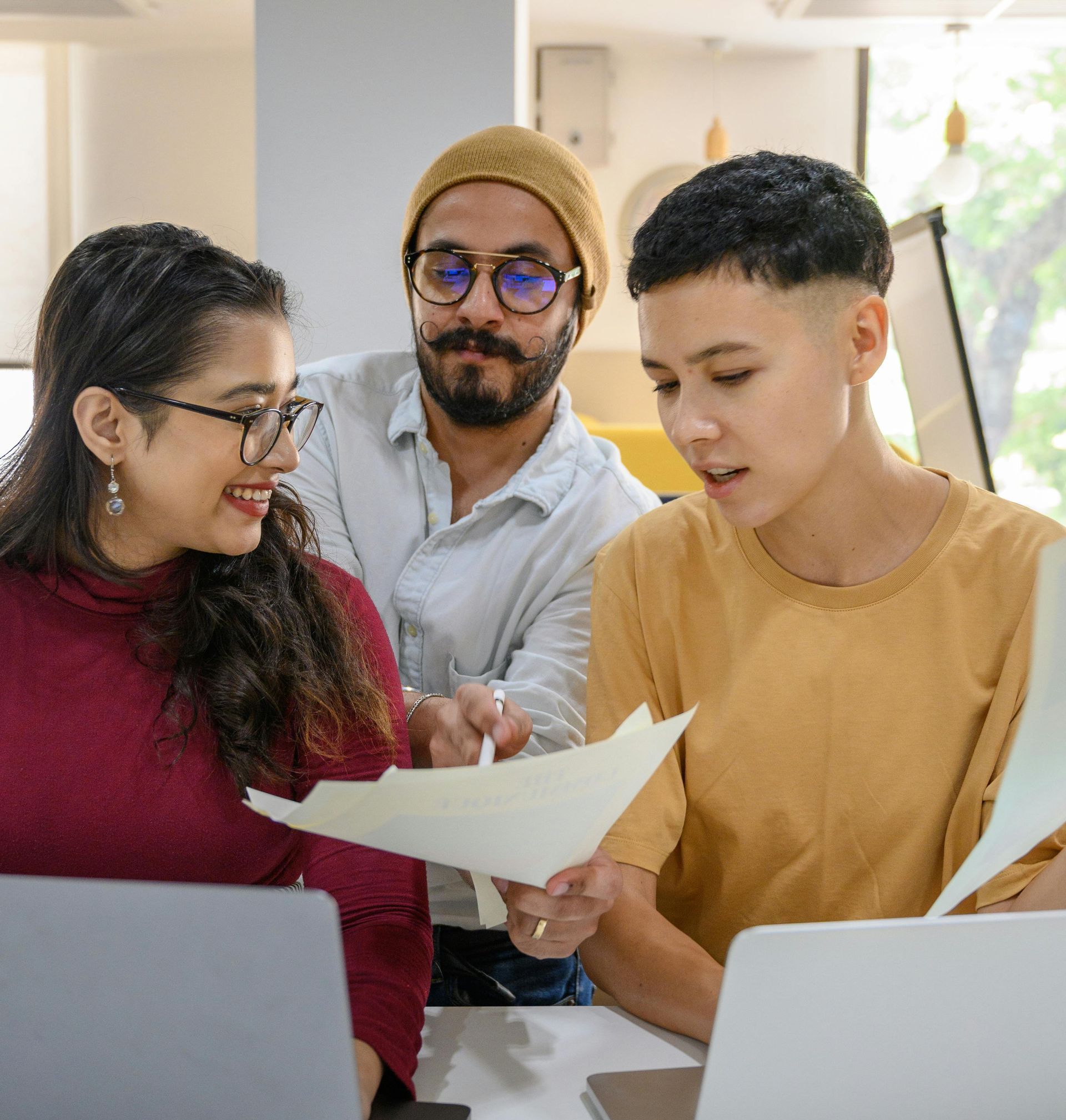 SEO professionals focused on a report, strategizing for online success SEO professionals focused on a report, strategizing for online success