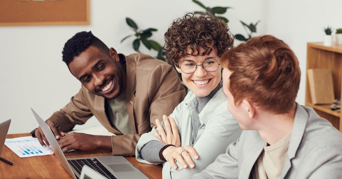 Three professionals collaborating on an SEO strategy