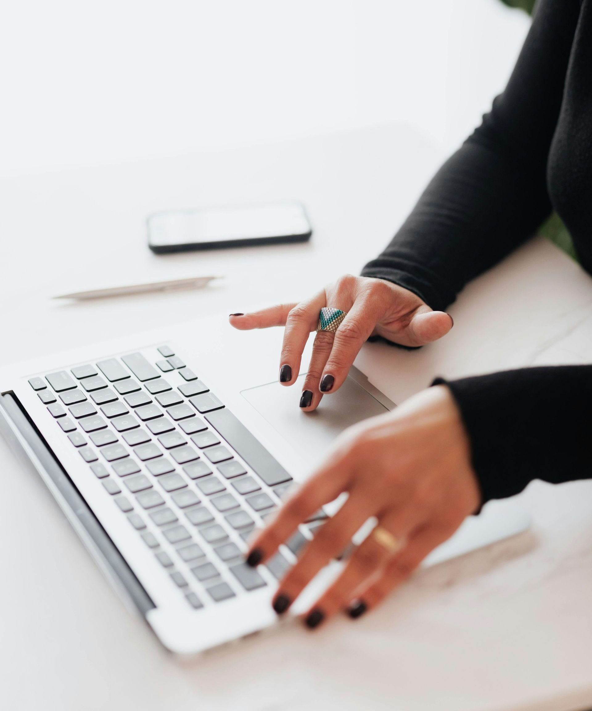 close-up of hands using a laptop doing SEO consultation to boost business success close-up of hands using a laptop doing SEO consultation to boost business success