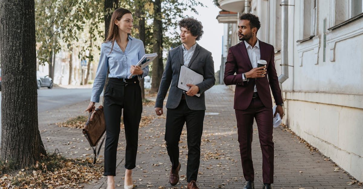 Lawyers walking down the street engaged in a conversation.