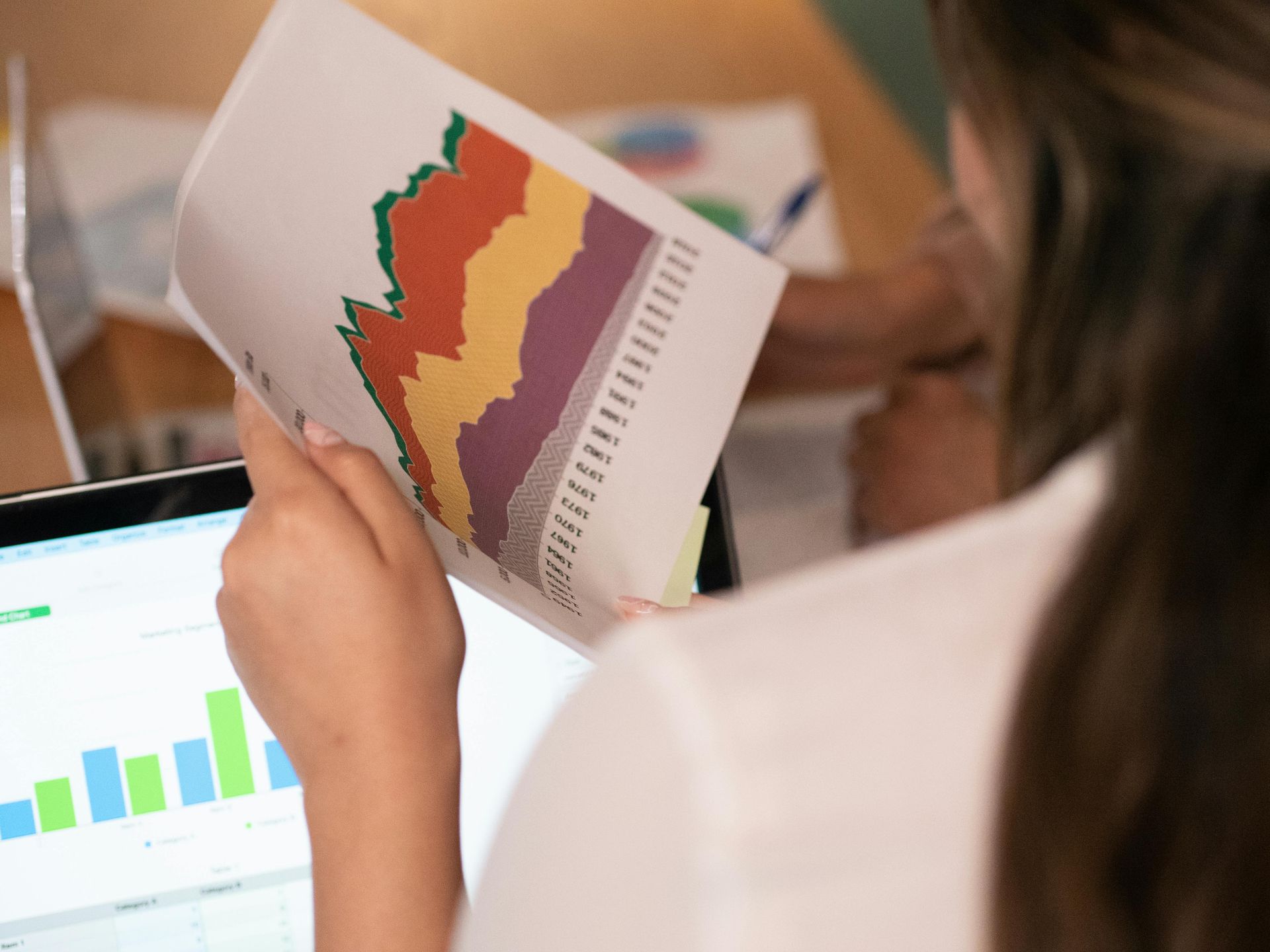 Delaware SEO expert reviewing graphs and analytics to develop strategies for driving business growth