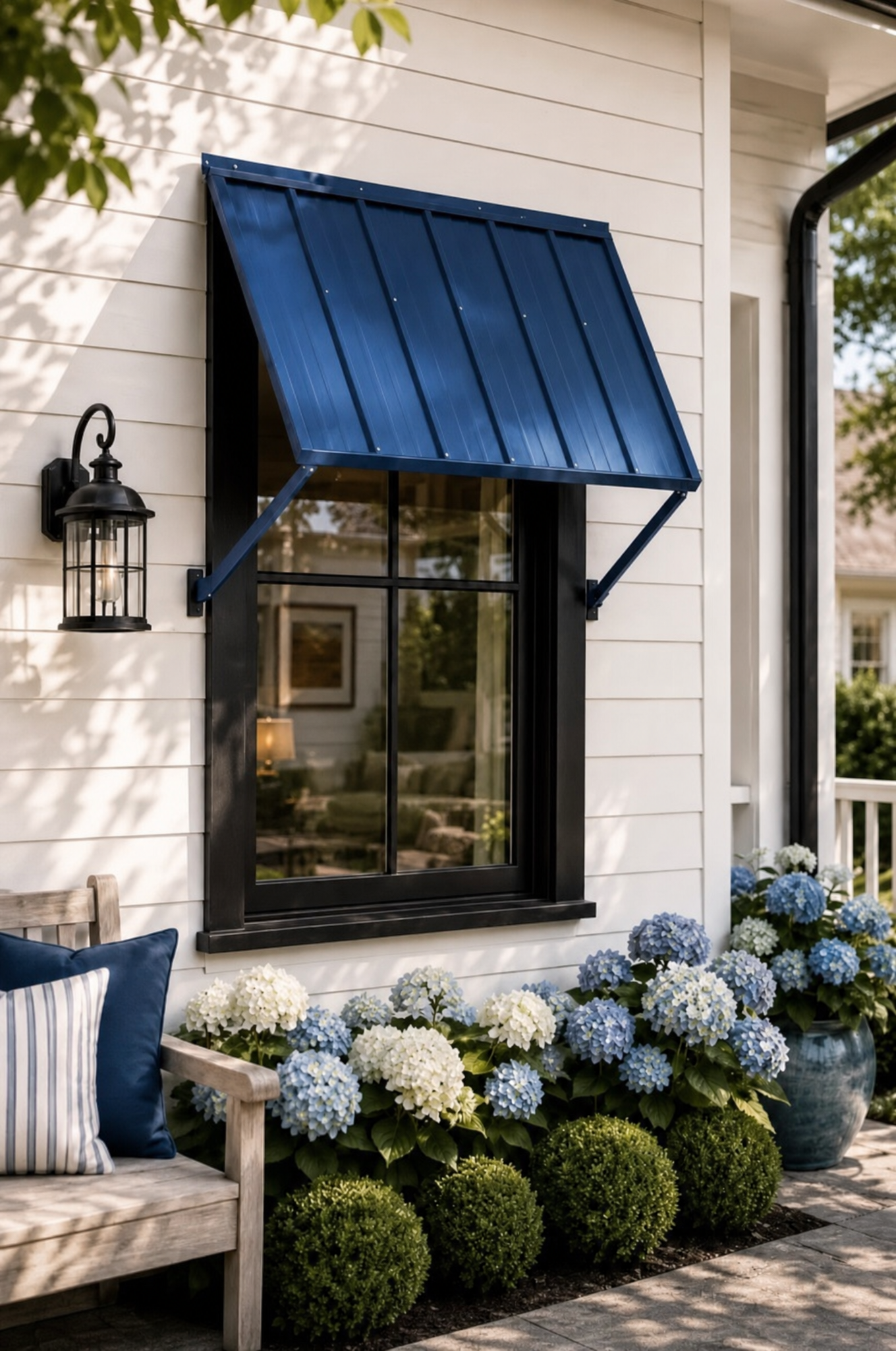 Exterior window and trim detail with metal awning