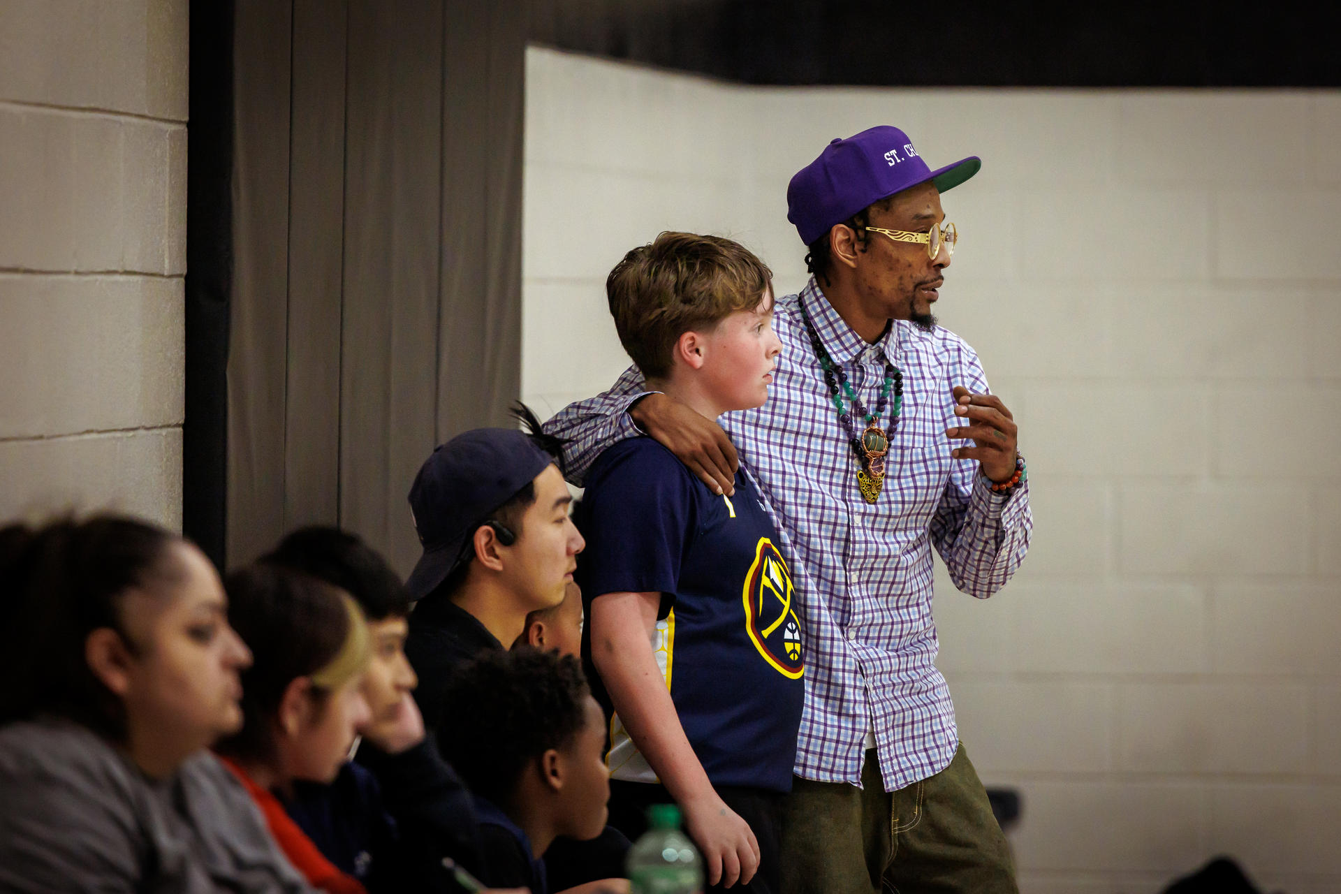 Basketball coach encouraging his team