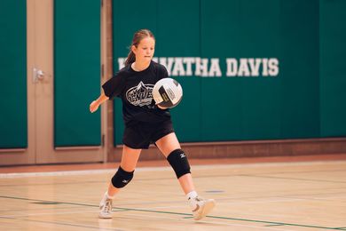 Youth volleyball player preparing to hit the ball