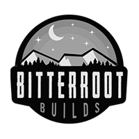Black-and-white Bitterroot Builds logo with mountains, moon, stars, and bold text