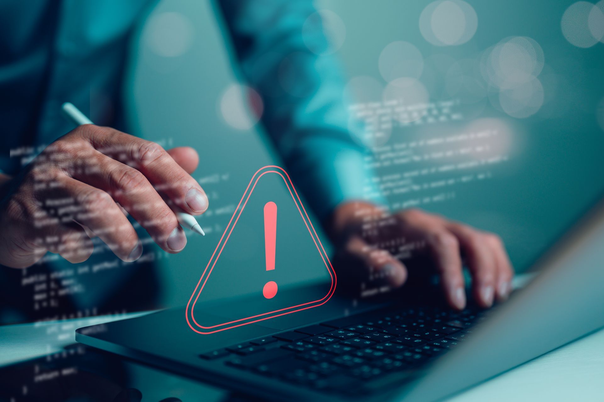Person using laptop with a red warning symbol overlaid, implying a security or software issue.
