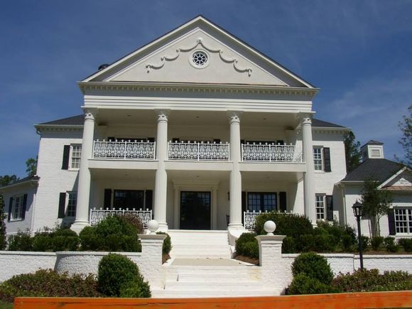 A large white house with columns and balconies