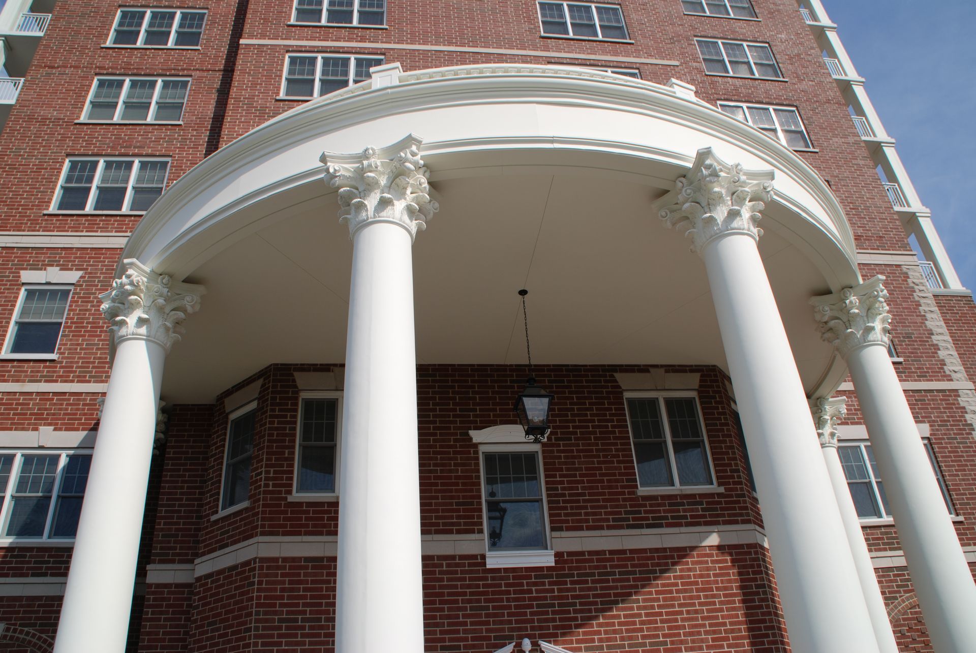 A large red brick building with white columns
